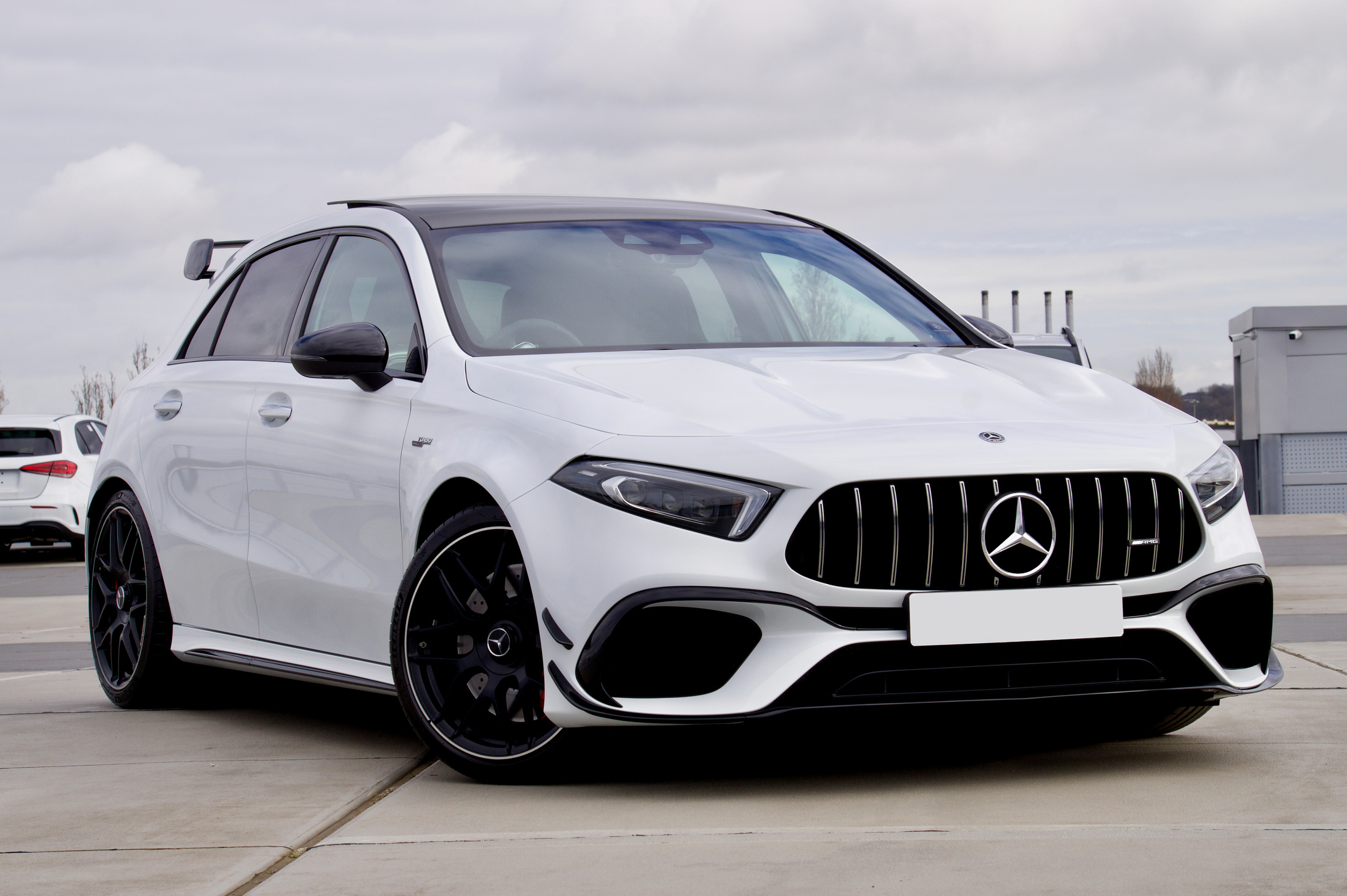 White Mercedes Benz Car Parked on the Road